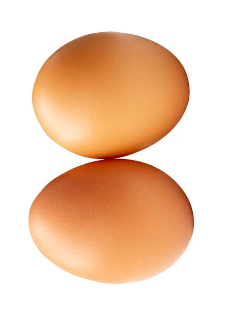Two fresh brown eggs isolated on white background