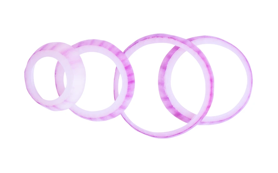 Sliced red onion rings isolated on white background