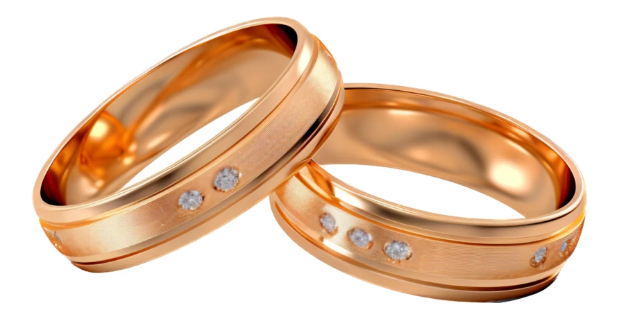 Pair of elegant gold wedding bands with inset diamonds