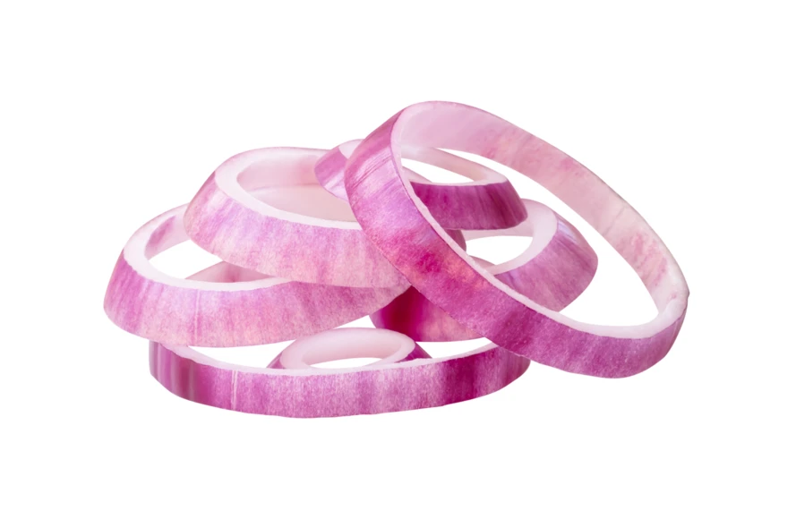 Sliced red onion rings isolated on white background