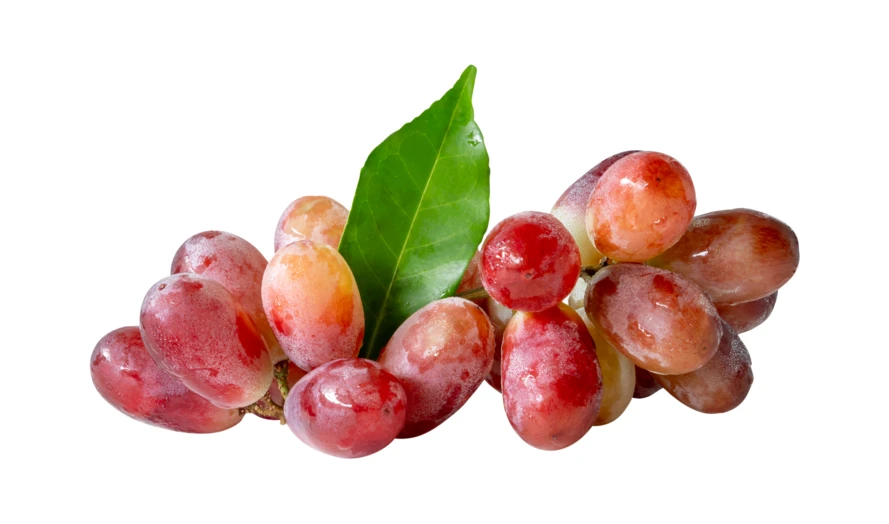 Fresh red grapes with green leaf on white background