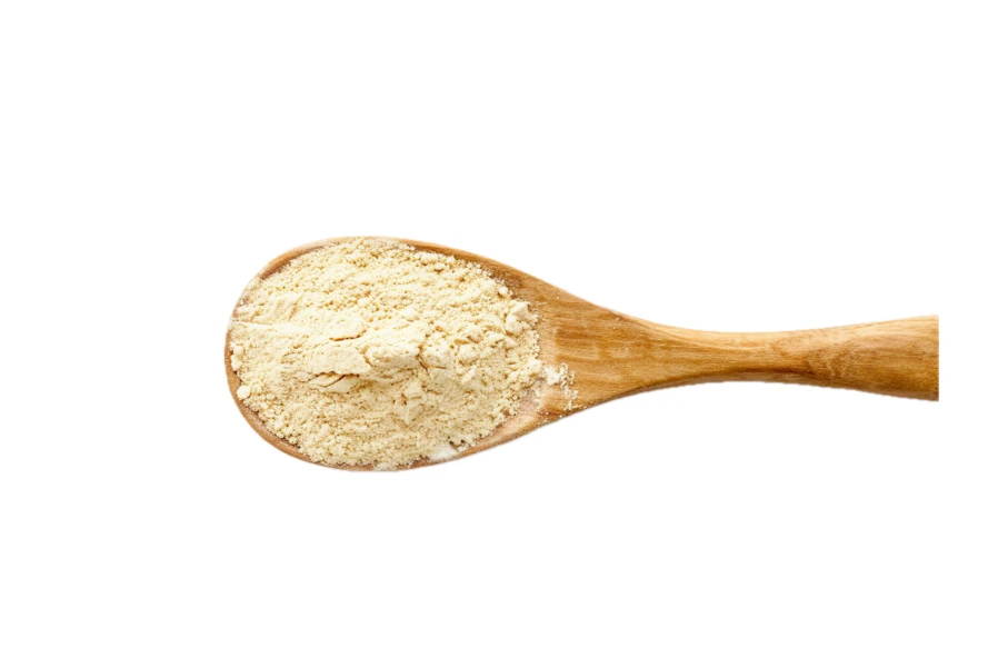 Wooden spoon with ginger powder isolated on white background