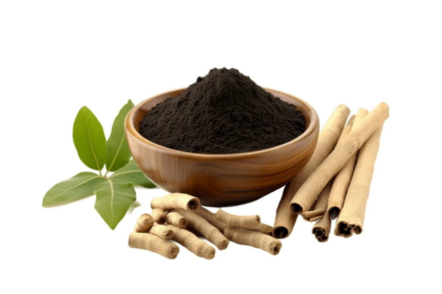 Black herbal powder in wooden bowl with roots and leaves