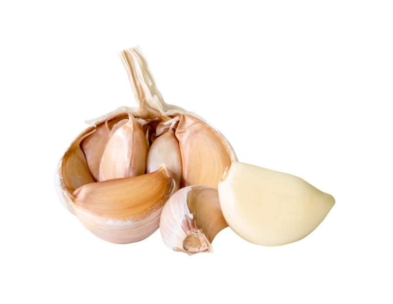 Broken garlic bulb with peeled and unpeeled cloves