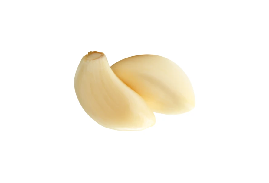 Two peeled garlic cloves isolated on white background