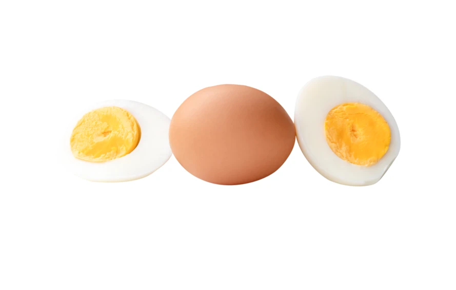 Brown egg and boiled egg halves on white background