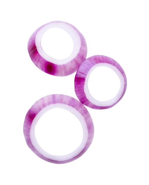 Three sliced red onion rings isolated on white background