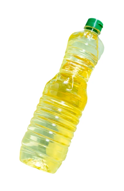 Plastic bottle of yellow cooking oil on white background