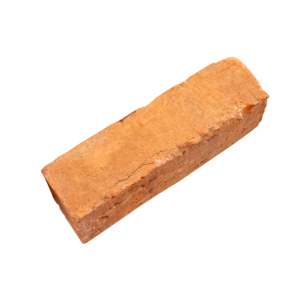 Single old red clay brick isolated on white background