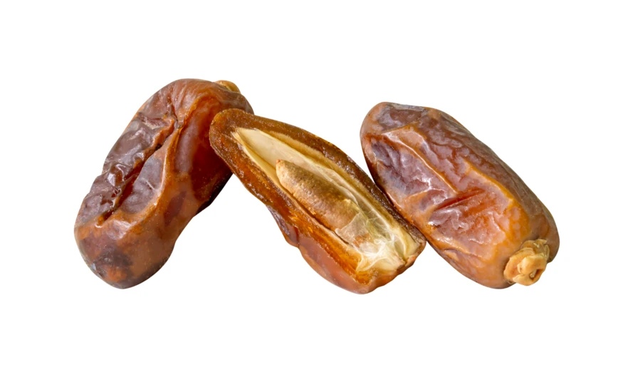 Dried dates isolated on white background with one split