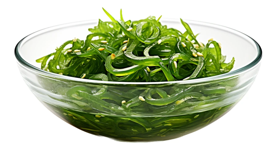 Japanese wakame seaweed salad in glass bowl isolated on white