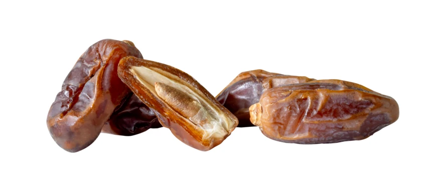Group of dried date fruits isolated on white background