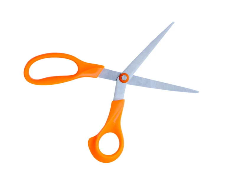 Open scissors with orange handles isolated on white background