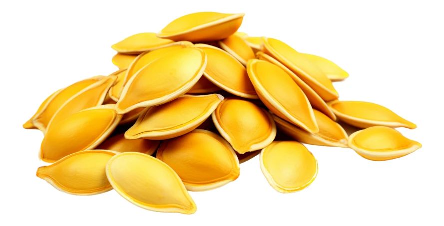 Pile of roasted pumpkin seeds isolated on white background