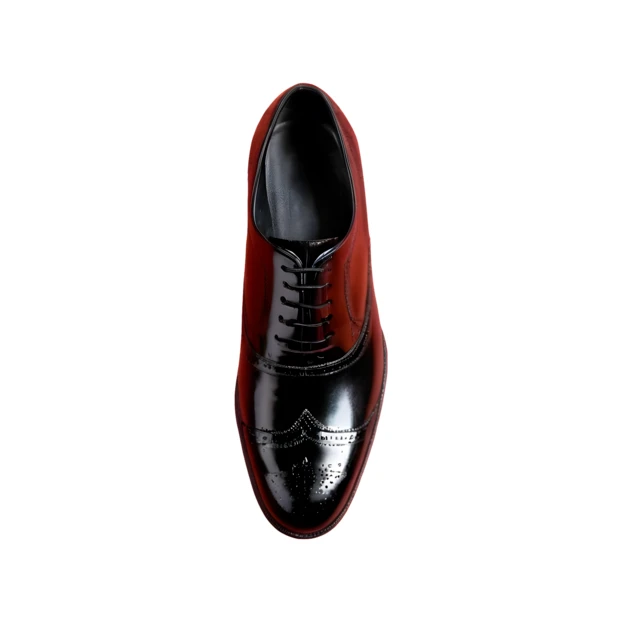 Top view of a black and red men's dress shoe