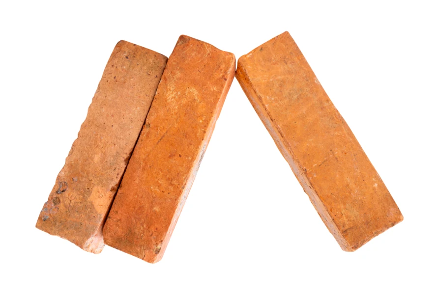 Three red clay bricks isolated on white background