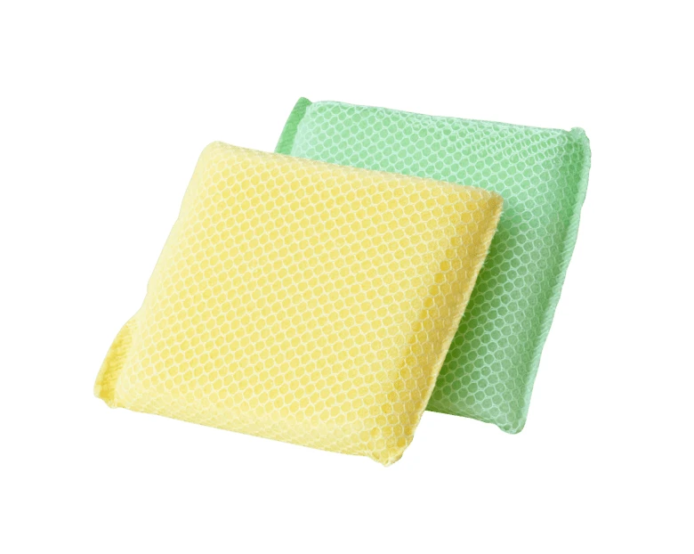 Yellow and green mesh cleaning sponges on white background