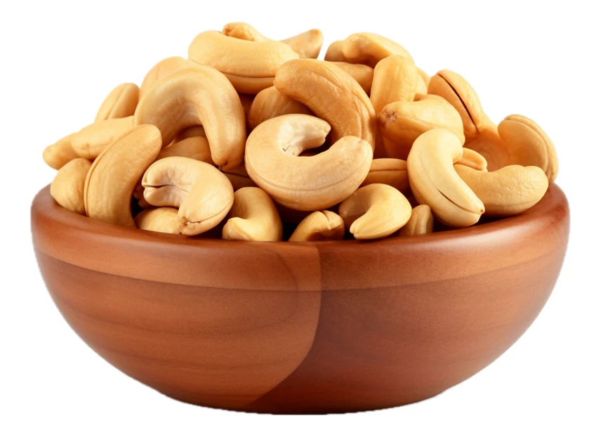 Roasted cashew nuts in a wooden bowl isolated on white