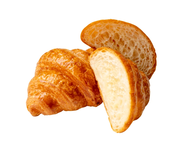 Fresh buttery sliced croissant isolated on white background