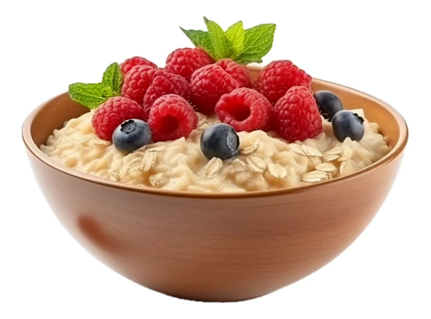 Oatmeal porridge with fresh raspberries and blueberries in a bowl