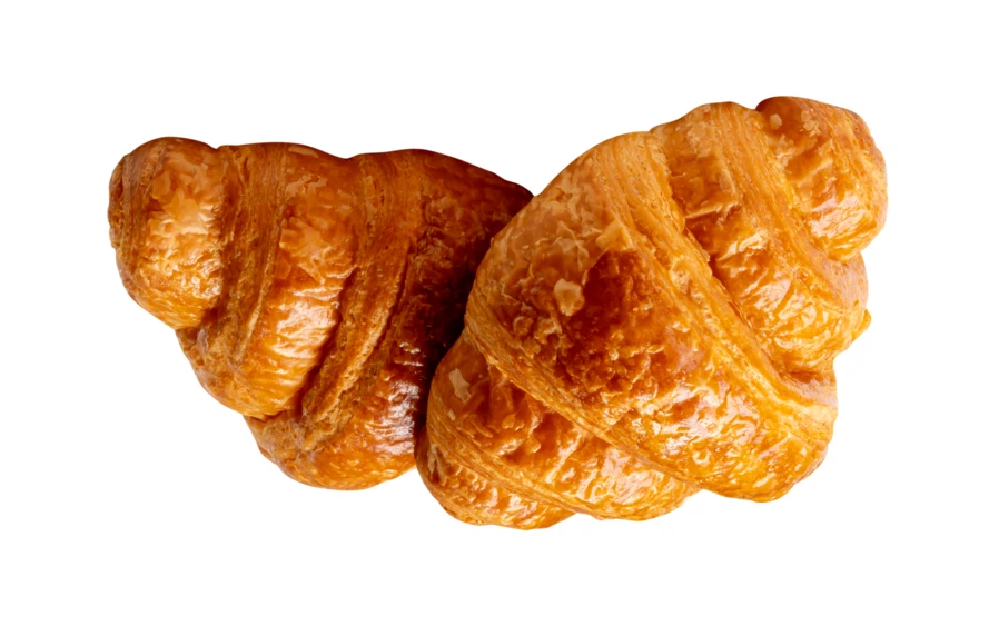 Two fresh golden croissants isolated on white background