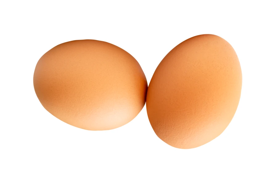 Two brown chicken eggs isolated on white background