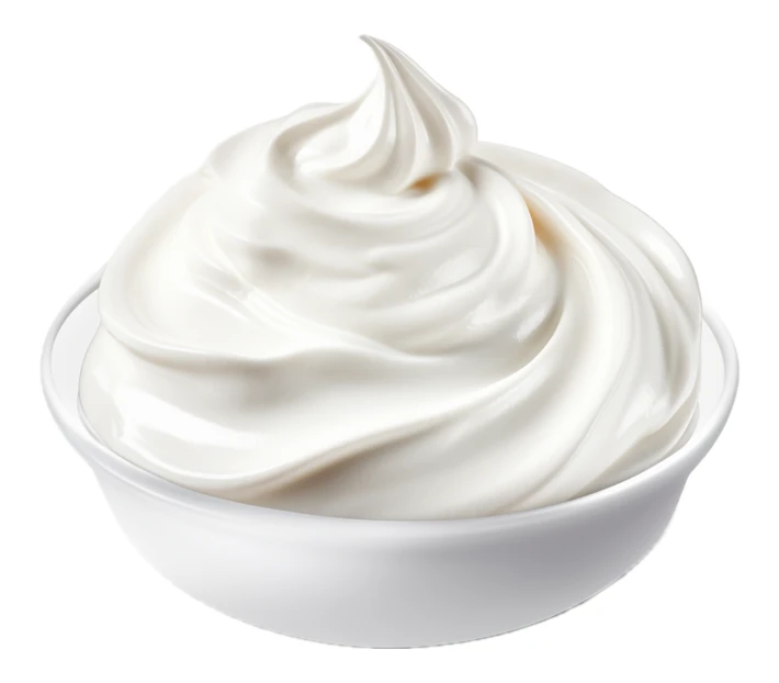 Swirl of white cream in a bowl isolated on white
