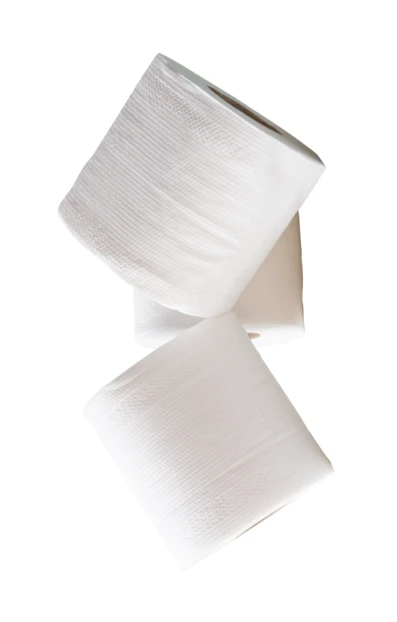 Three white toilet paper rolls falling against white background