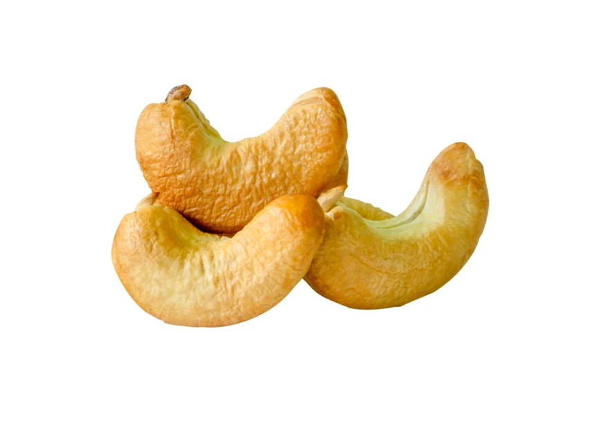 Three roasted cashew nuts isolated on white background
