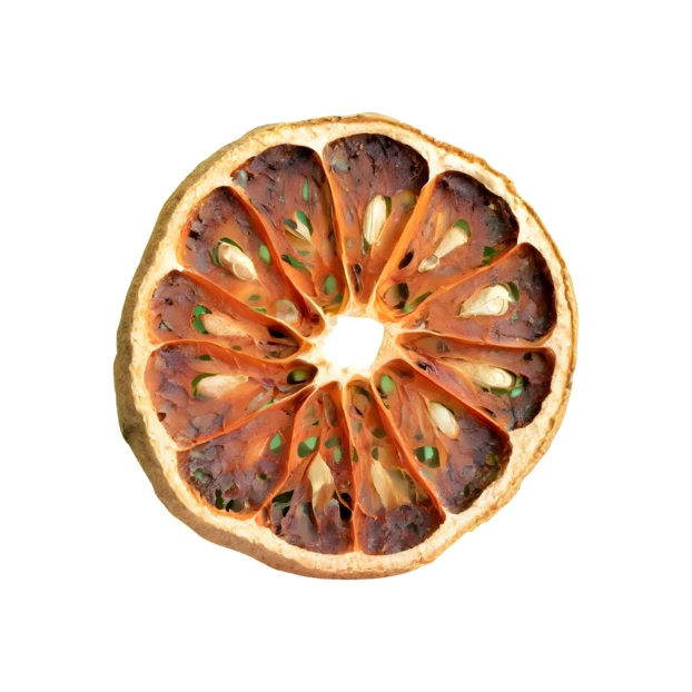 Single slice of dried Bael fruit on white background