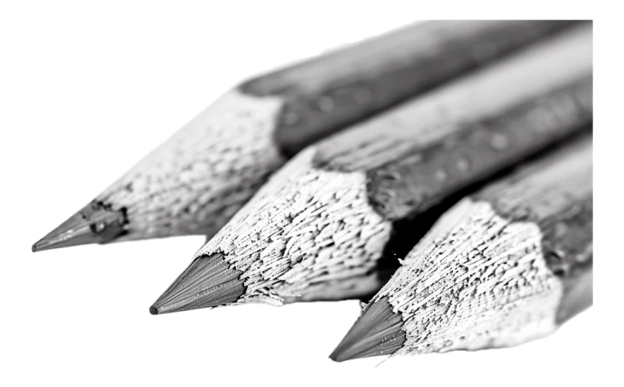 Macro close up of three sharpened pencils in black and white