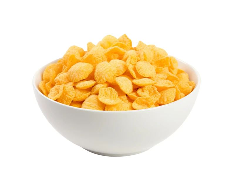 Bowl of crunchy golden cornflakes isolated on white background