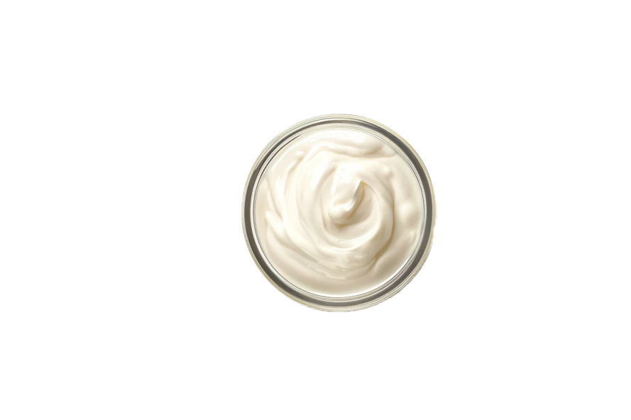 Top view of white creamy sauce in a bowl