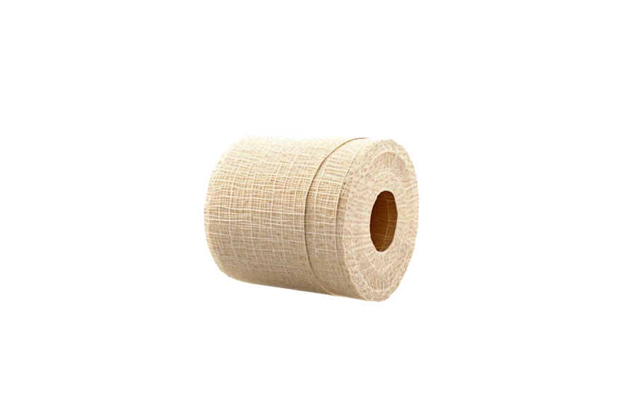 Roll of beige elastic medical bandage on white background