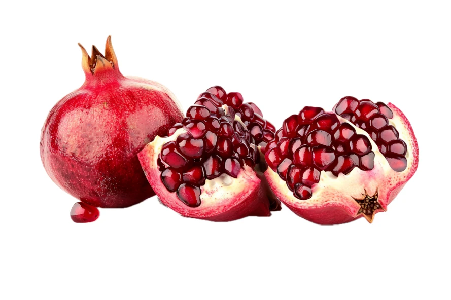 Whole and sliced fresh pomegranate fruit isolated on white background