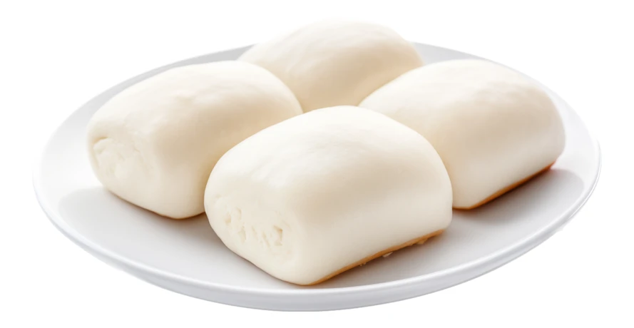 Chinese steamed mantou buns on a white plate isolated