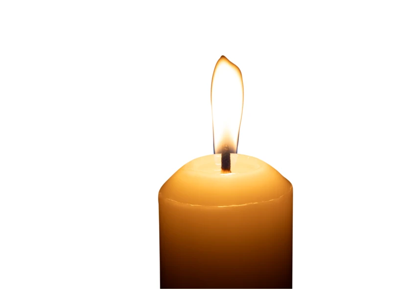 Burning pillar candle with bright flame on white background