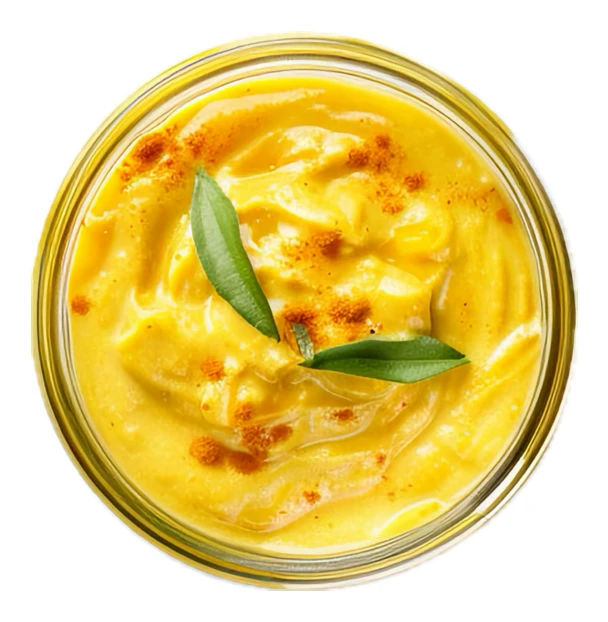 Curry sauce or spicy dip in glass bowl on white