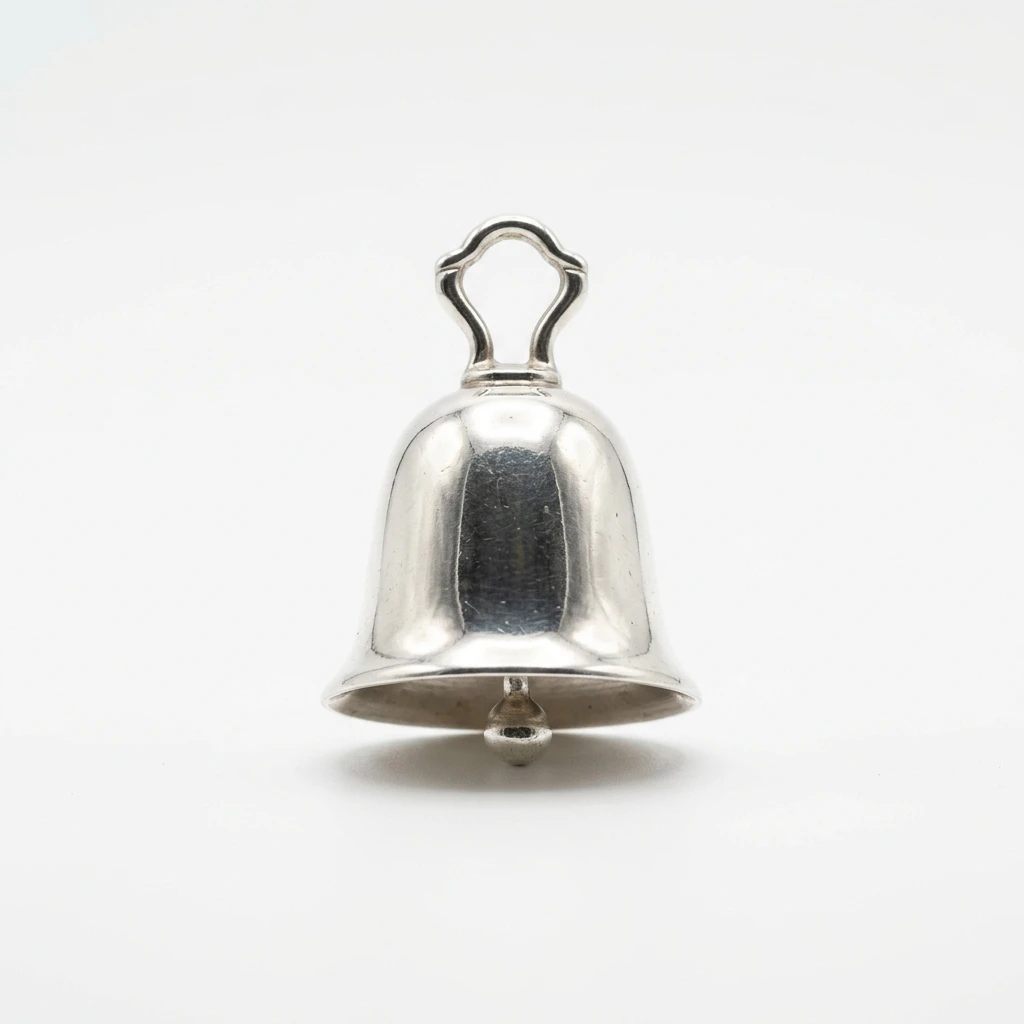 Polished silver bell on a white background