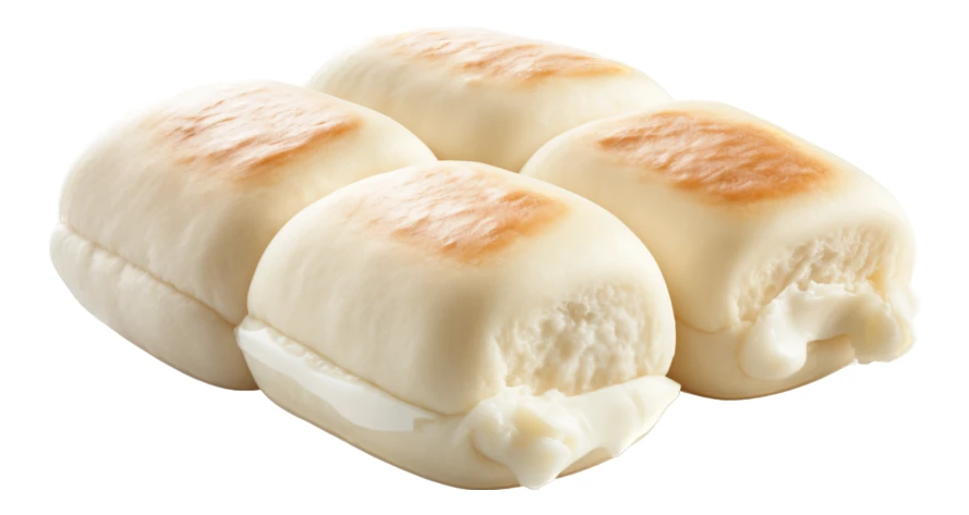 Four toasted bread rolls with cream filling on white background