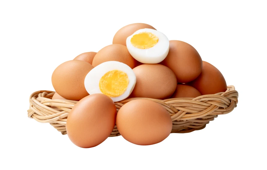 Basket of brown eggs with two hard-boiled halves