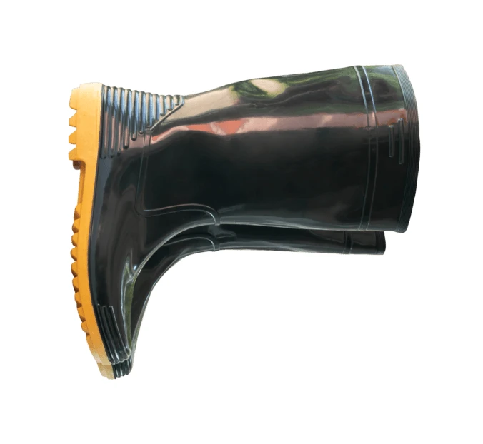 Pair of black rubber boots with yellow soles isolated