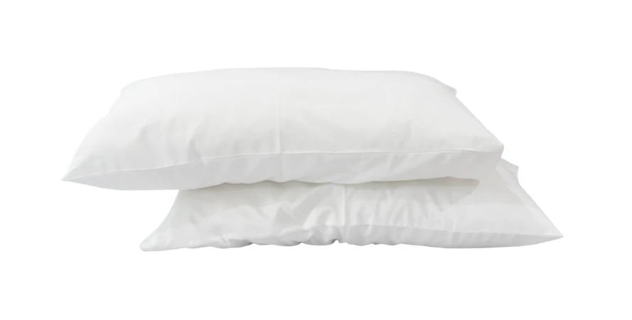 Two soft white bed pillows stacked on white background