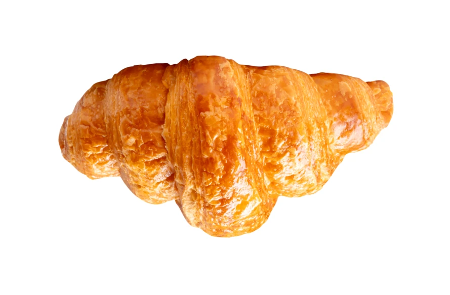 Fresh golden buttery croissant isolated on white background