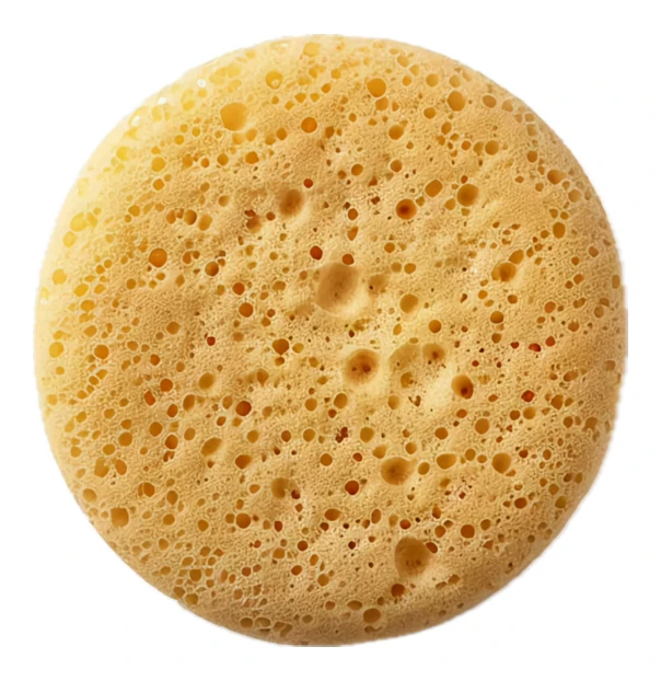 Round yellow porous cosmetic sponge isolated on white background