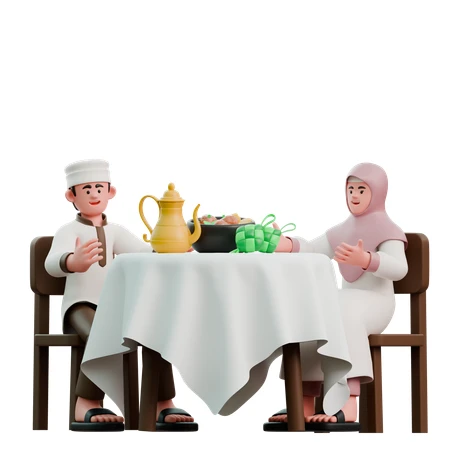 Couple sitting at a table with food