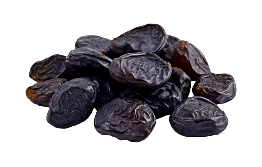 Pile of dried black raisins isolated on white background