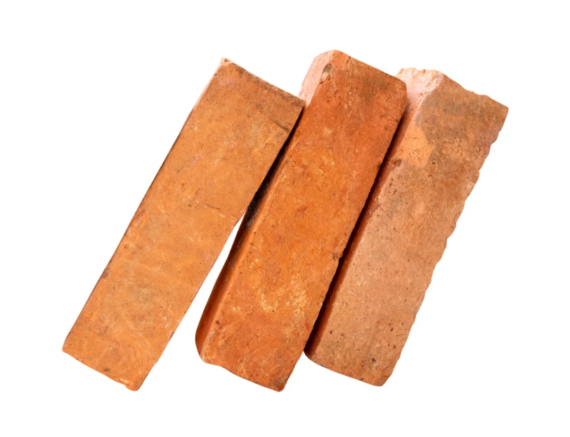 Three red clay bricks isolated on white background