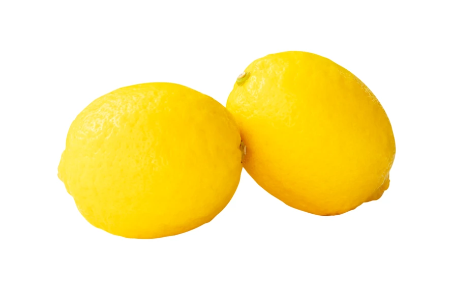 Two whole yellow lemons isolated on white background