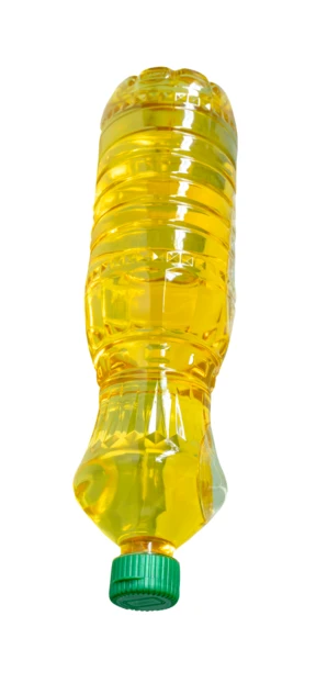 Plastic bottle of vegetable oil isolated on white background